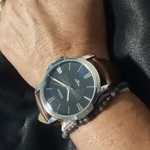 Easy view watch large bezel black face stainless steel back water proof. Leather